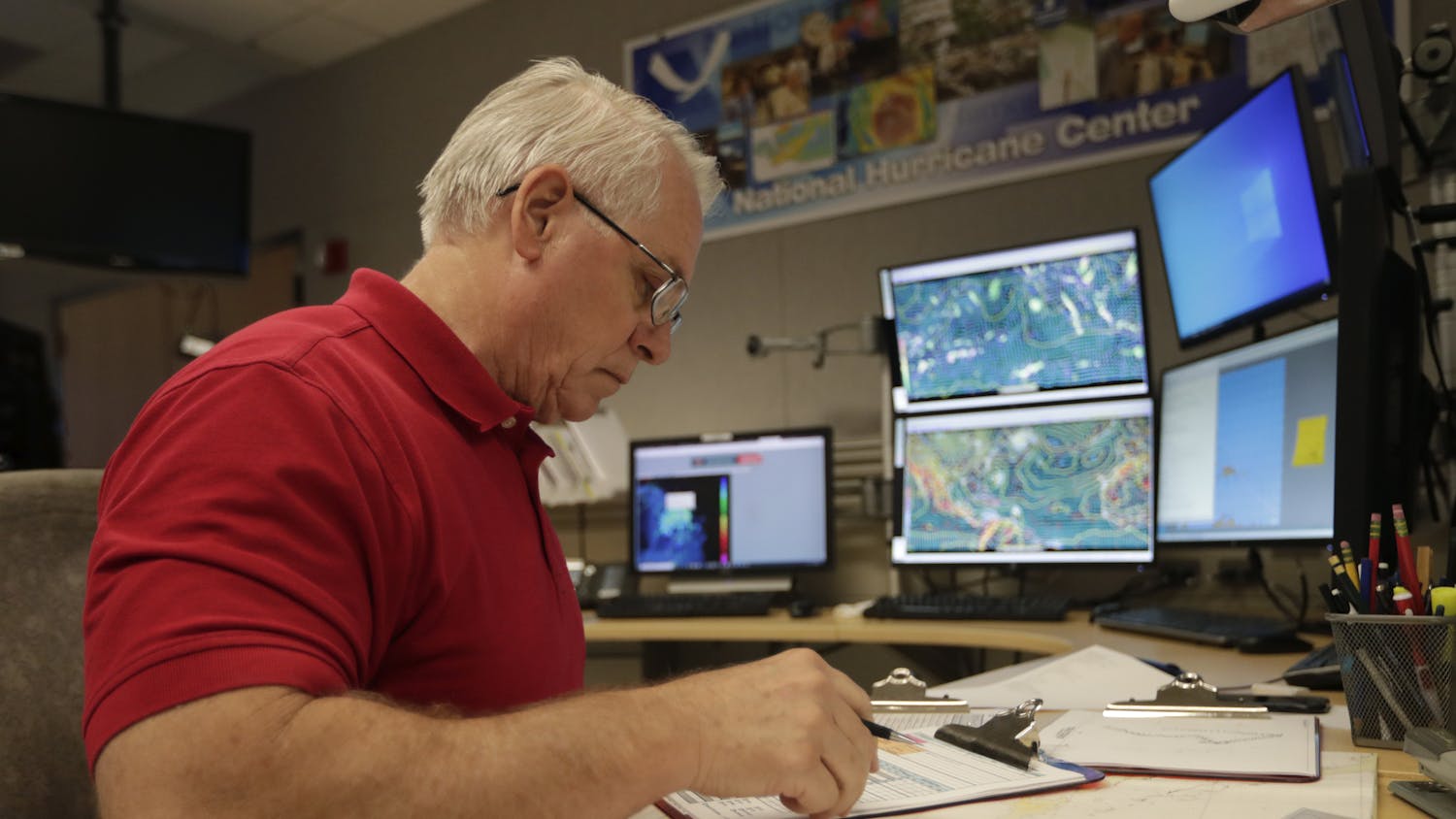 Senior hurricane specialist Stacy Stewart monitors the progress of Tropical Storm Dorian at the National Hurricane Center, Tuesday, in Miami.