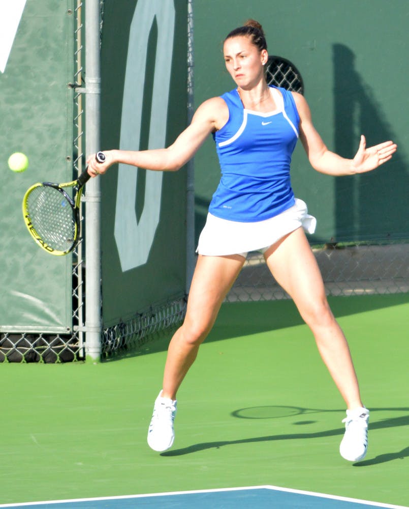 Sofie Oyen returns a ball during Florida’s 7-0 win against Florida State on Feb. 18 at the Ring Tennis Complex.