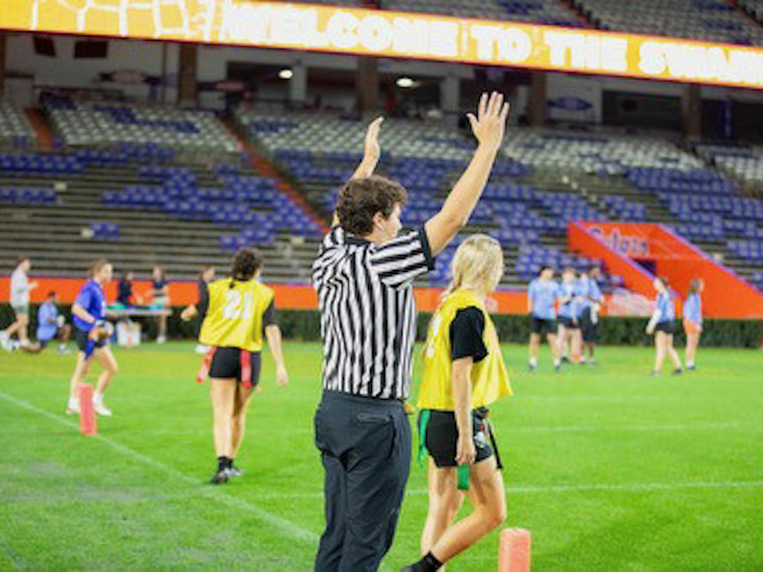 Patrick Garcia signals a touchdown in an intramural flag football game during Fall 2023 at Ben Hill Griffin Stadium. Photo courtesy of RecSports Staff.