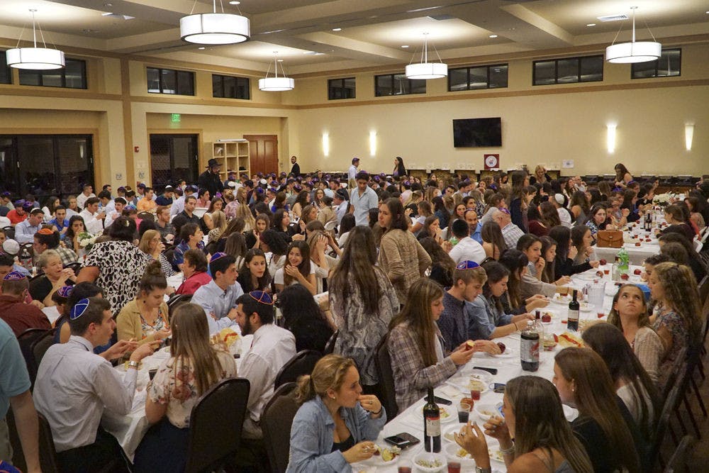 <p>Students and community members gather at Lubavitch-Chabad Jewish Student &amp; Community Center for Rosh Hashanah, the Jewish new year, on Sept. 13, 2015. About 450 people celebrated together with apples and honey, a traditional part of Rosh Hashanah.</p>