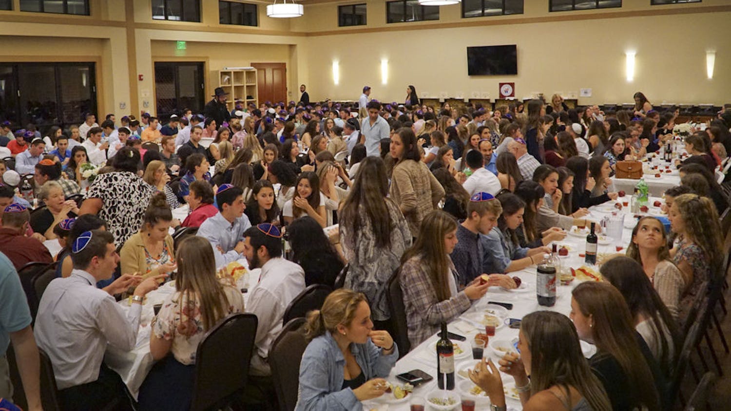 Students and community members gather at Lubavitch-Chabad Jewish Student & Community Center for Rosh Hashanah, the Jewish new year, on Sept. 13, 2015. About 450 people celebrated together with apples and honey, a traditional part of Rosh Hashanah.