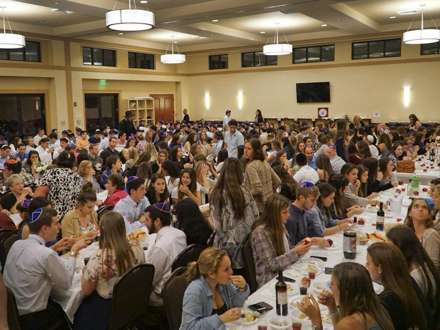 Students and community members gather at Lubavitch-Chabad Jewish Student & Community Center for Rosh Hashanah, the Jewish new year, on Sept. 13, 2015. About 450 people celebrated together with apples and honey, a traditional part of Rosh Hashanah.