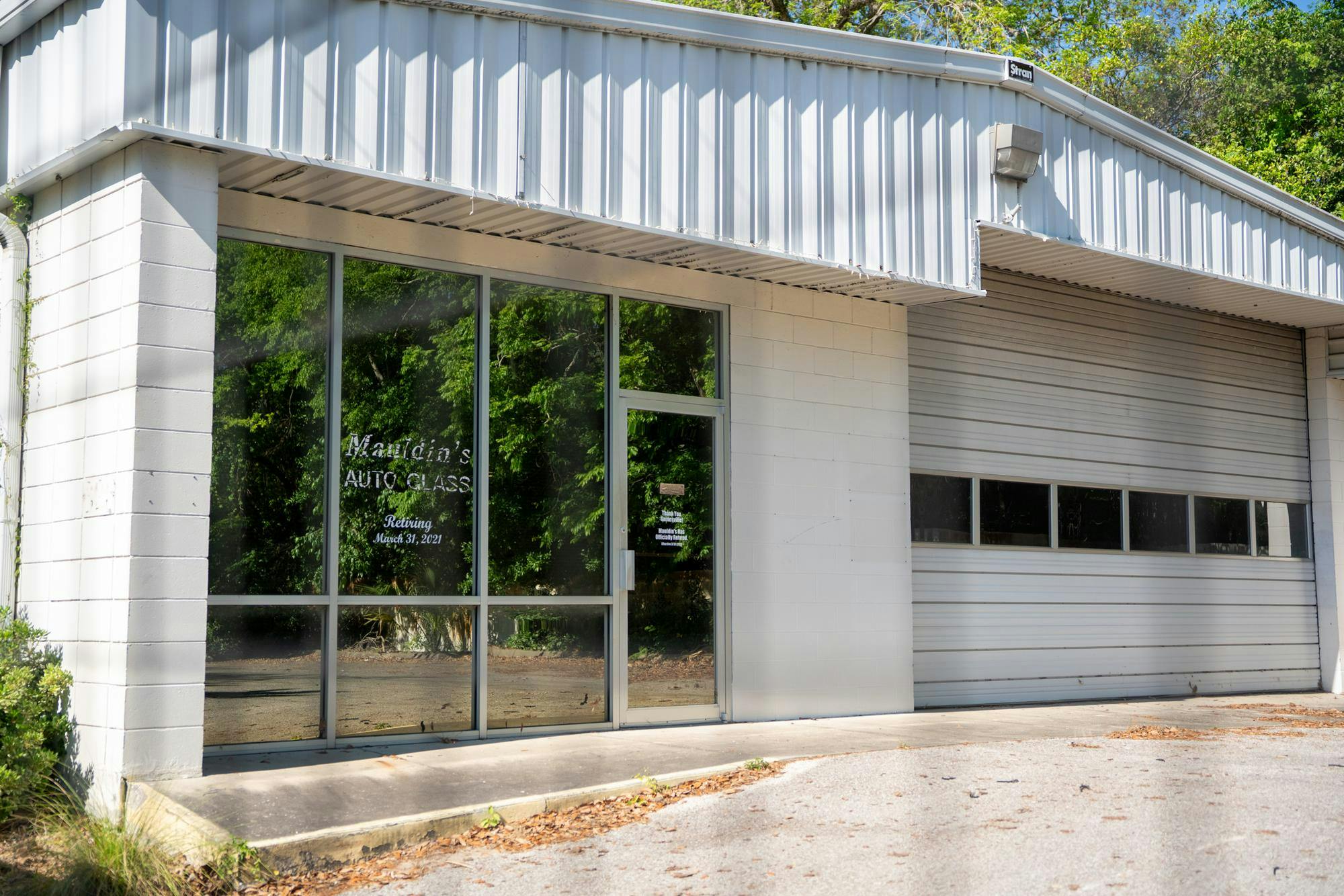 Mauldin's Auto Glass sits behind Santa Fe College's Blount Center at 530 W University Ave, Friday, April 17, 2026, in Gainesville, Fla.