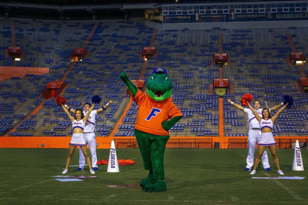 <p><span id="docs-internal-guid-75c06a7a-7fff-57be-5487-59e80f078006"><span>Albert the Alligator leads the “2-bits, 4-bits” cheer for a crowd of about 2,000 students Tuesday evening in the stadium.</span></span></p>