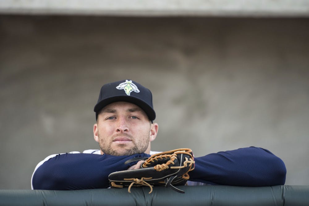 Columbia Fireflies outfielder Tim Tebow looks out from the dugout before the team's minor league baseball game against the Augusta GreenJackets on Thursday, April 6, 2017, in Columbia, S.C. Columbia defeated Augusta 14-7. (AP Photo/Sean Rayford)