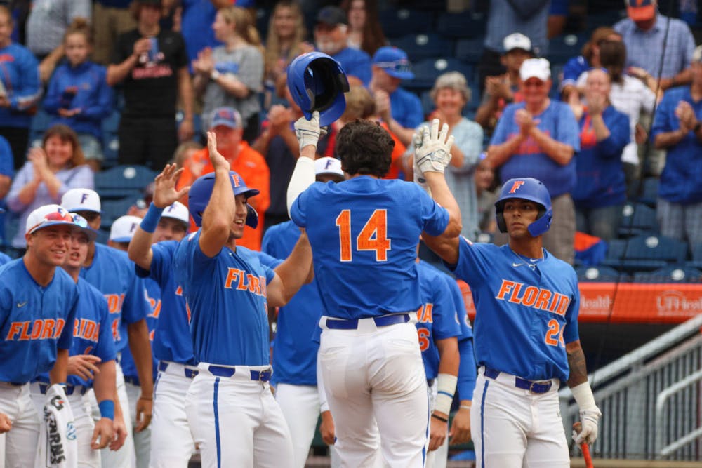 Florida two-way player Jac Caglianone walks to the dugout after a home run in the Gators' 14-6 loss to the Miami Hurricanes March 4, 2023.