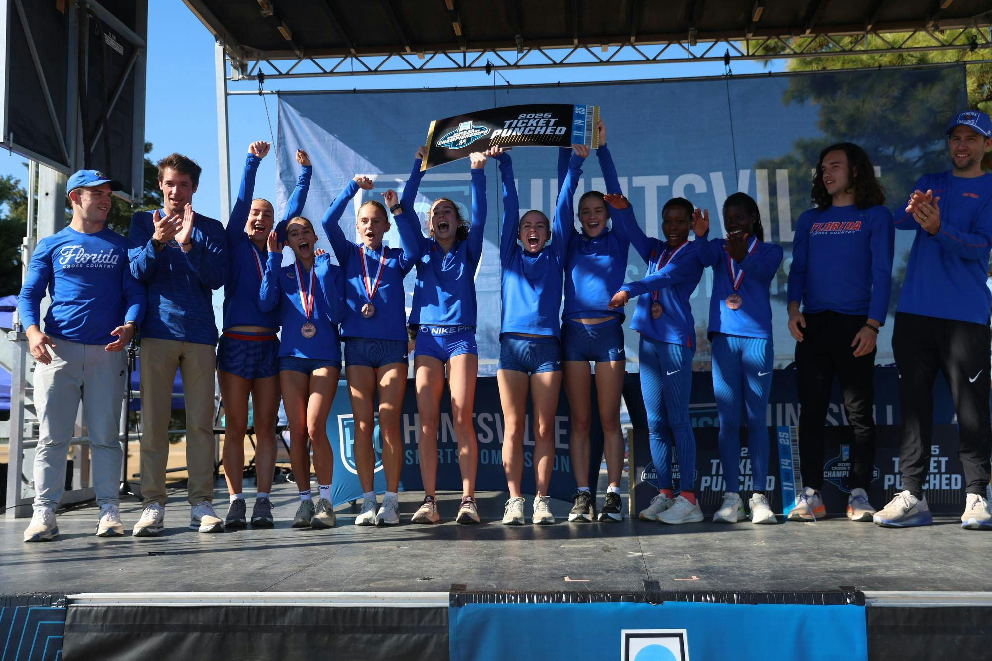 The Gators celebrate a victory during the NCAA Regionals cross country meet on Friday, November 14, 2025 at John Hunt Park in Huntsville, Ala. / UAA Communications photo by Dylan Cannella