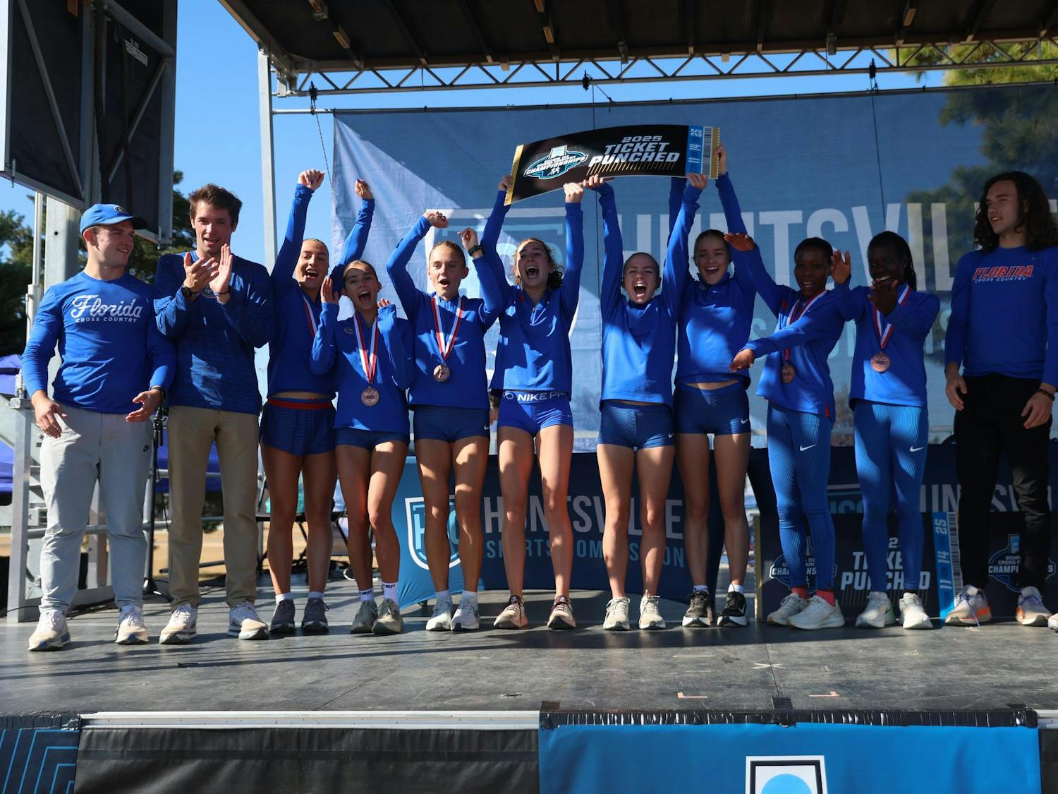 The Gators celebrate a victory during the NCAA Regionals cross country meet on Friday, November 14, 2025 at John Hunt Park in Huntsville, Ala. / UAA Communications photo by Dylan Cannella