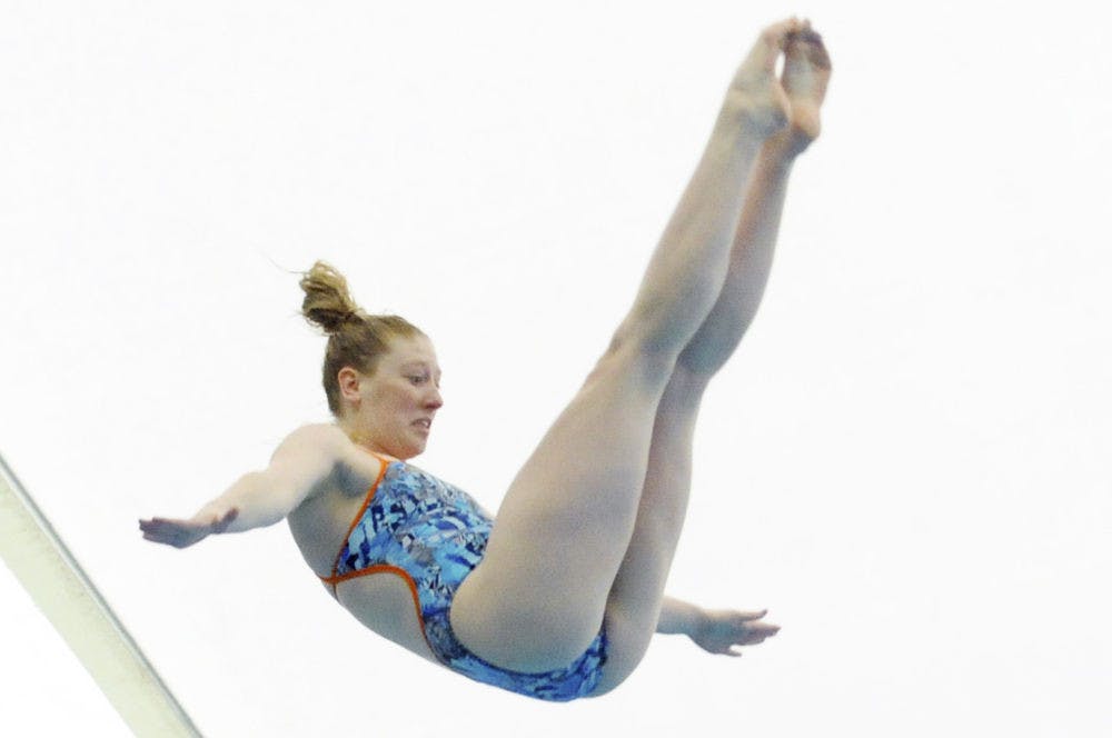 Khalia Warner dives during Florida’s meet against Auburn on Jan. 23, 2016, in the O’Connell Center.