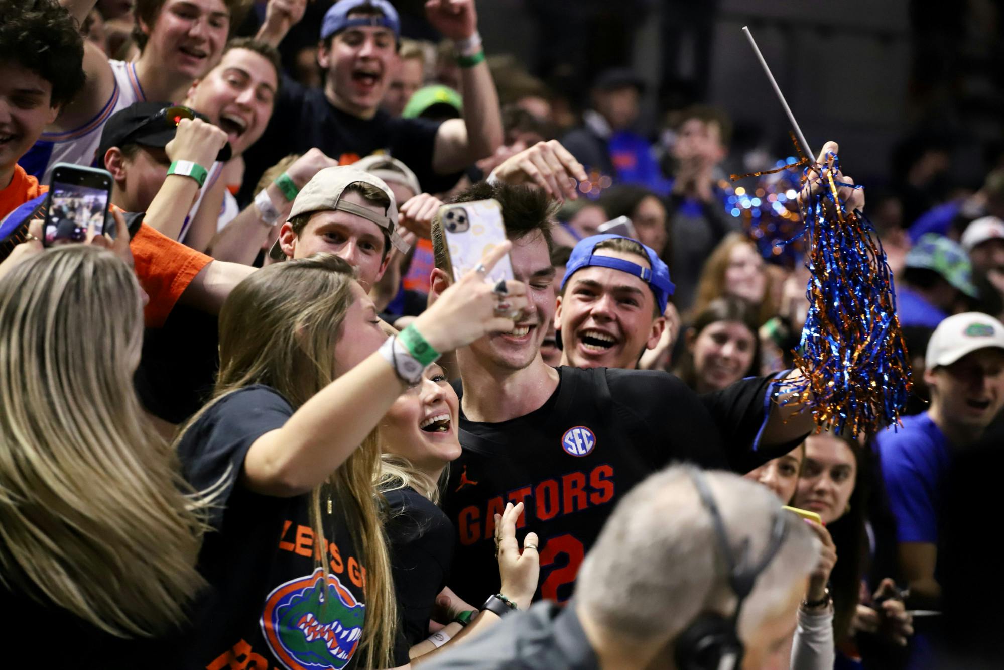 Florida senior forward Colin Castleton joins the Rowdy Reptiles to celebrate upset over No. 2 Auburn.