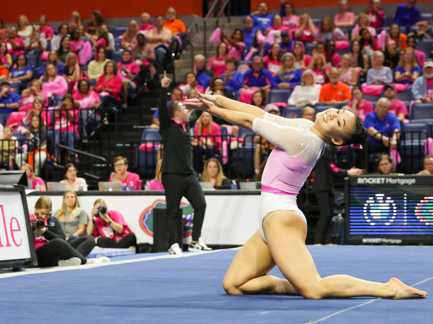 Leanne Wong finishes her floor routine with a gator chomp in a victory against the Missouri Tigers, Friday, Feb. 10, 2023. 