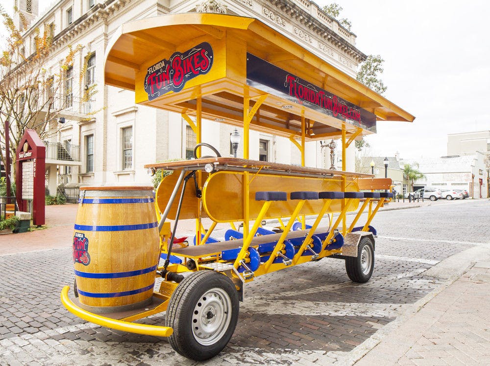 <p>Pictured above is a fun bike, a 16-person pedal bar that allows people to pedal together to get to bars. Florida Fun Bikes, located at 530 W. University Ave., will have its grand opening on Feb. 11, 2016, from 5 p.m. to 7 p.m.</p>