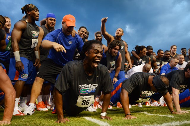 Gator football player Moses Jenkins fights through fatigue during a push-up contest at the fourth annual Gator Charity Challenge at Ben Hill Griffin Stadium on Friday night. The event featured a number of strength and speed competitions and all benefits went to the local chapter of The Salvation Army. Walk-on fullback Jesse Schmitt won the push-up challenge, beating nearly 90 other players; Jenkins made it to the top five.