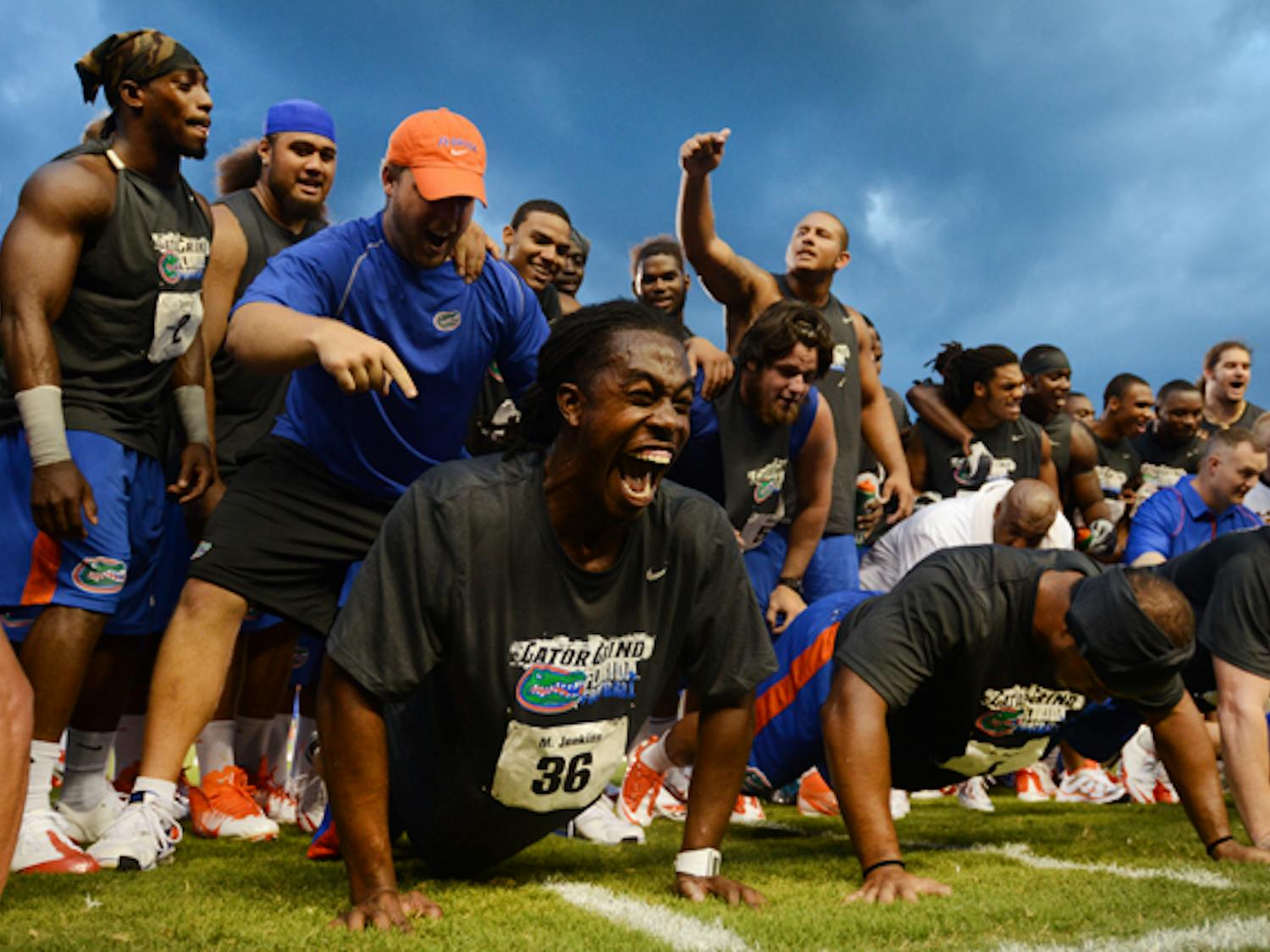 Gator football player Moses Jenkins fights through fatigue during a push-up contest at the fourth annual Gator Charity Challenge at Ben Hill Griffin Stadium on Friday night. The event featured a number of strength and speed competitions and all benefits went to the local chapter of The Salvation Army. Walk-on fullback Jesse Schmitt won the push-up challenge, beating nearly 90 other players; Jenkins made it to the top five.