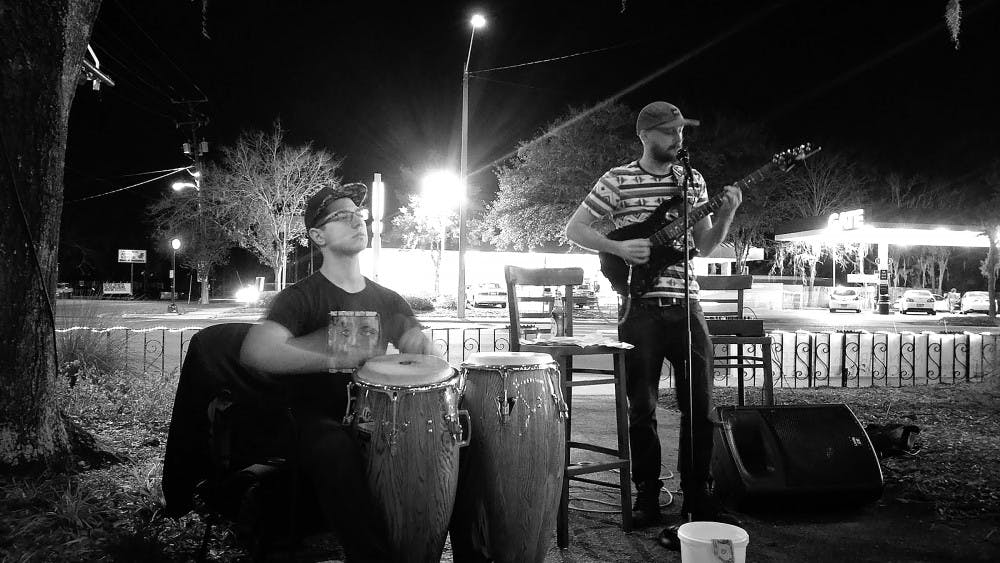 For the first time, SweetBerries Eatery and Frozen Custard hosted live musicians on its patio. From left: Zach Montague and David Cotton performed at the store’s four-year anniversary party.