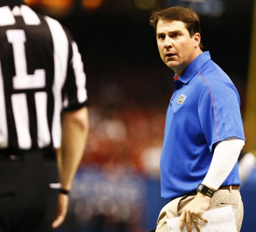 <p>Gators coach Will Muschamp exchanges words with a&nbsp;referee&nbsp;during the Allstate Sugar Bowl at the Mercedes-Benz Superdome in New Orleans, La. Florida lost to Louisville 33-23.</p>
