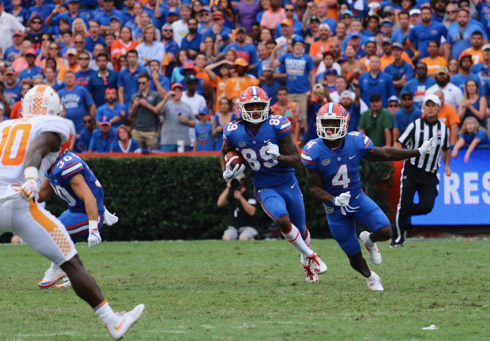 <p>Tyrie Cleveland (89) runs with the ball during Florida's 26-20 win against Tennessee on Saturday at Ben Hill Griffin Stadium.</p>