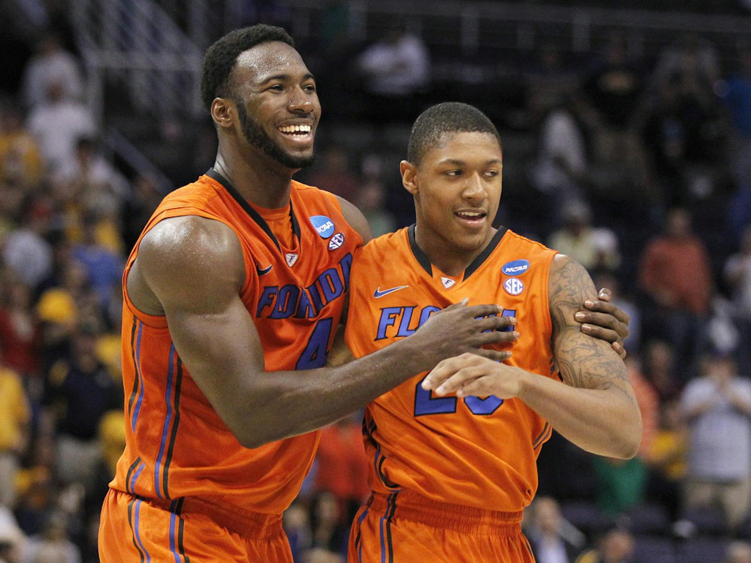 Florida center Patric Young embraces guard Brad Beal during the team’s Sweet 16 meeting with Marquette in 2012.