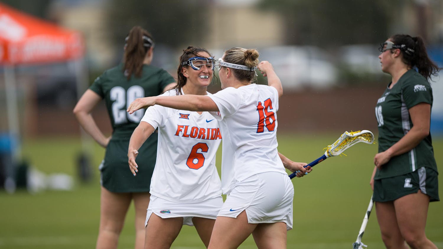 Florida gators attack Jordan Basso (6) hugs teammate Frannie Hahn (16) after she scores a goal in a lacrosse game against Loyola Maryland in Gainesville, Fla., on Saturday, March 8, 2025.