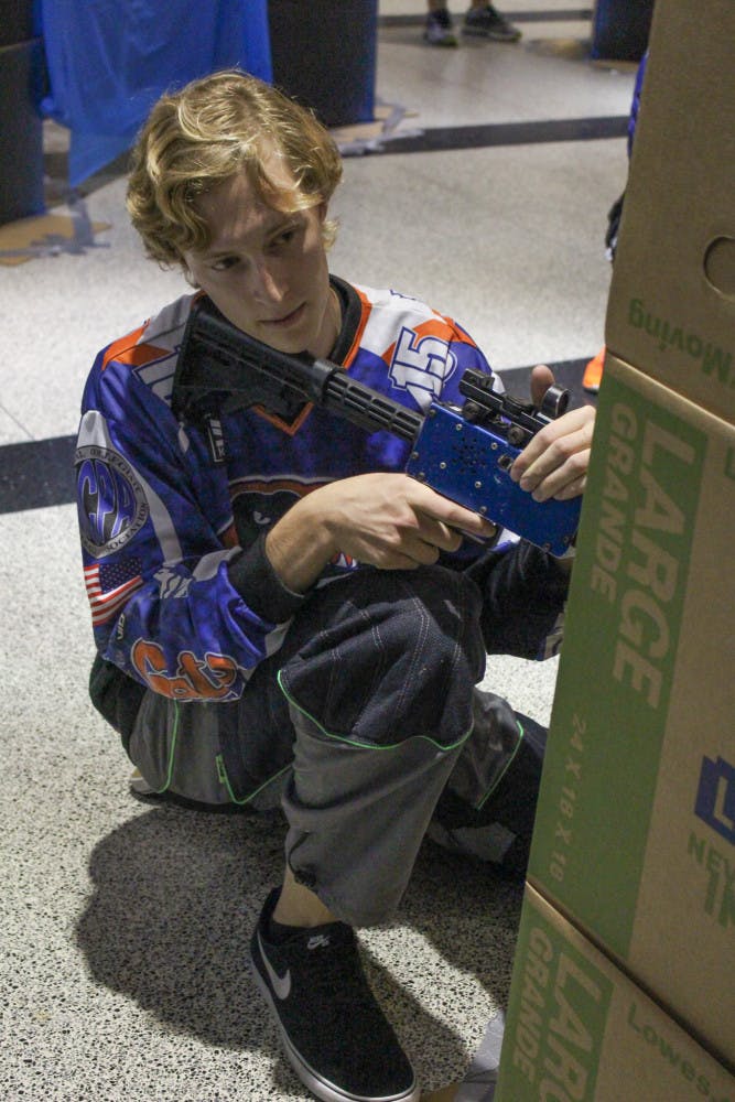 Timothy De Marcken, a 20-year-old UF mechanical engineering sophomore, attends the laser tag event at the Physics Building hosted by the Astronomy and Astrophysics Society, along with the Society of Physics Students, on Friday. The purpose of the event was to raise money for a conference this November.
