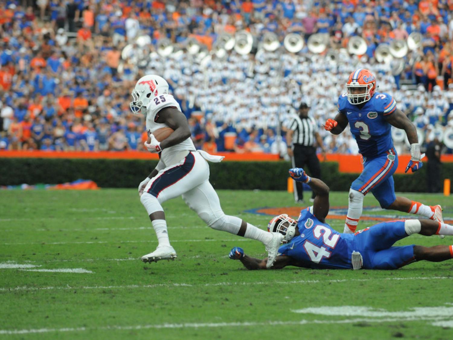 UF's Antonio Morrison (3) pursues an FAU player during Florida's 20-14 overtime win against Florida Atlantic on Nov. 21, 2015, at Ben Hill Griffin Stadium.