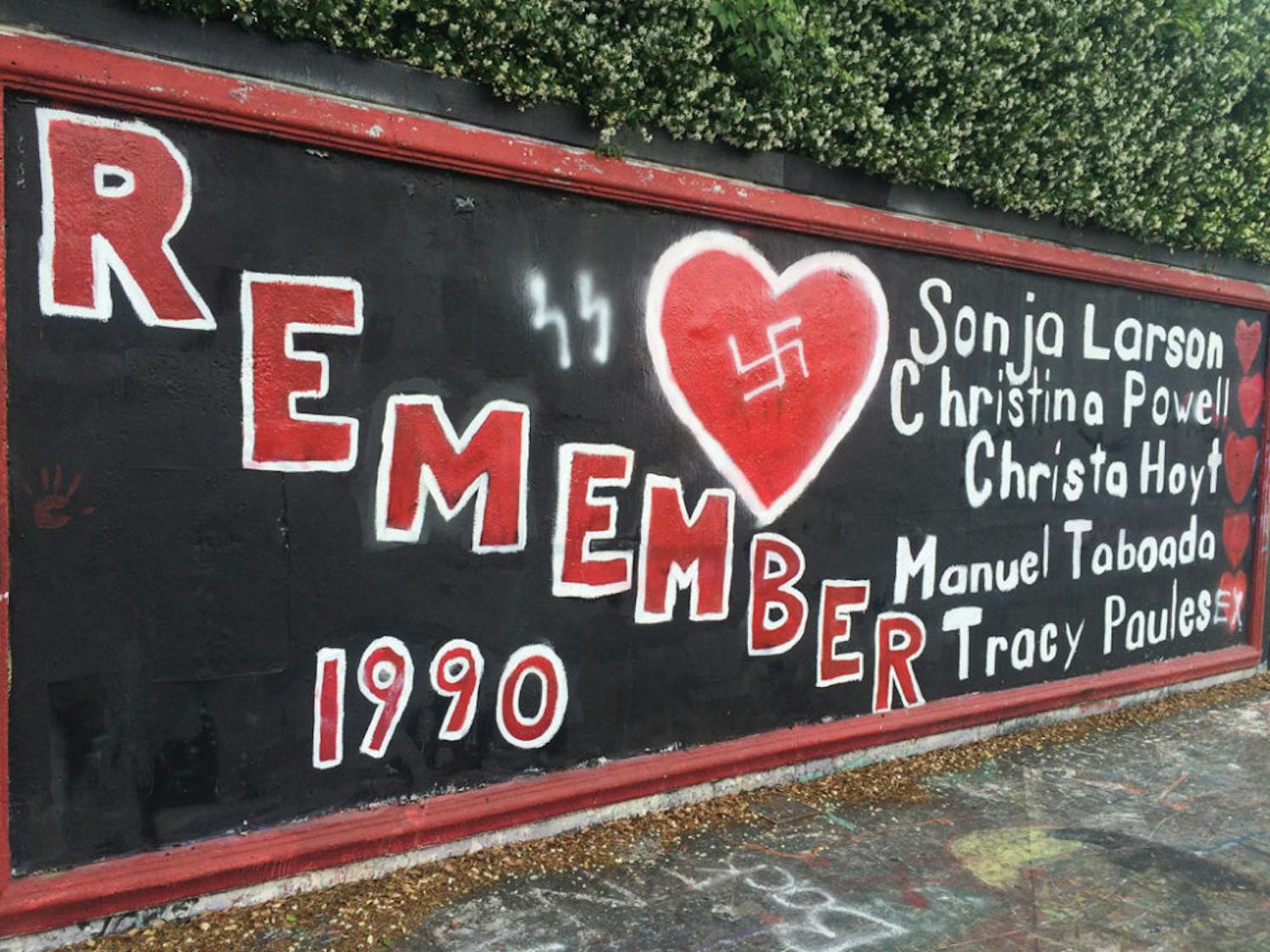 Three Gainesville Police officers responded to the 34th Street Wall after one or more people spray painted a swastika on its memorial, which honors five students murdered in 1990. “It is sick,” a responding GPD officer said.