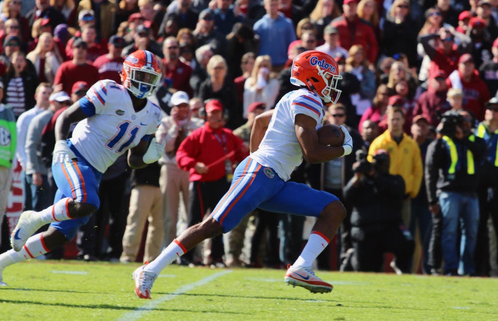 Cornerback CJ Henderson (right) exited Saturday’s game against Georgia with a lower back injury. Coach Dan Mullen said the sophomore didn’t sustain any structural damage.