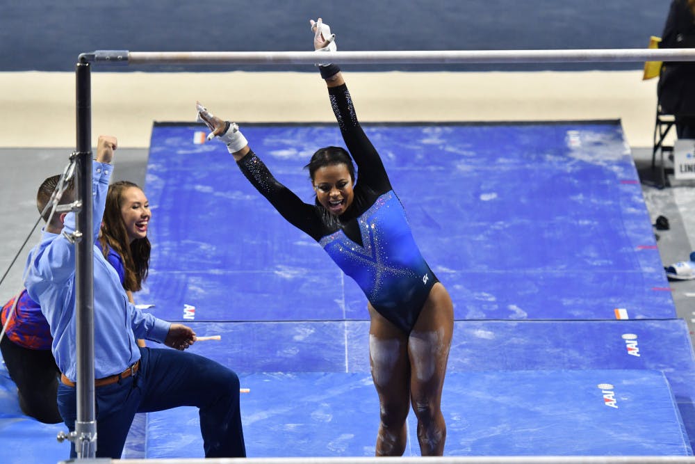 Kennedy Baker sticks the landing on her bars routine during the Gainesville NCAA gymnastics regional on April 1, 2017. 