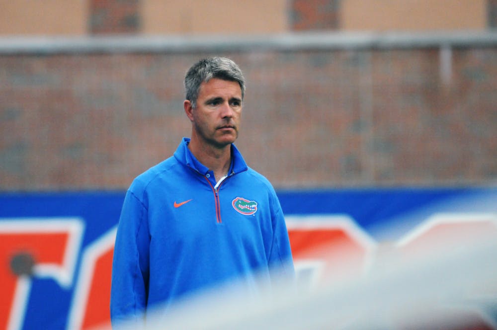 <p><span>Roland Thornqvist watches on as his team competes in singles during their win against South Florida on Jan. 27, 2016, at the Ring Tennis Complex.</span></p>