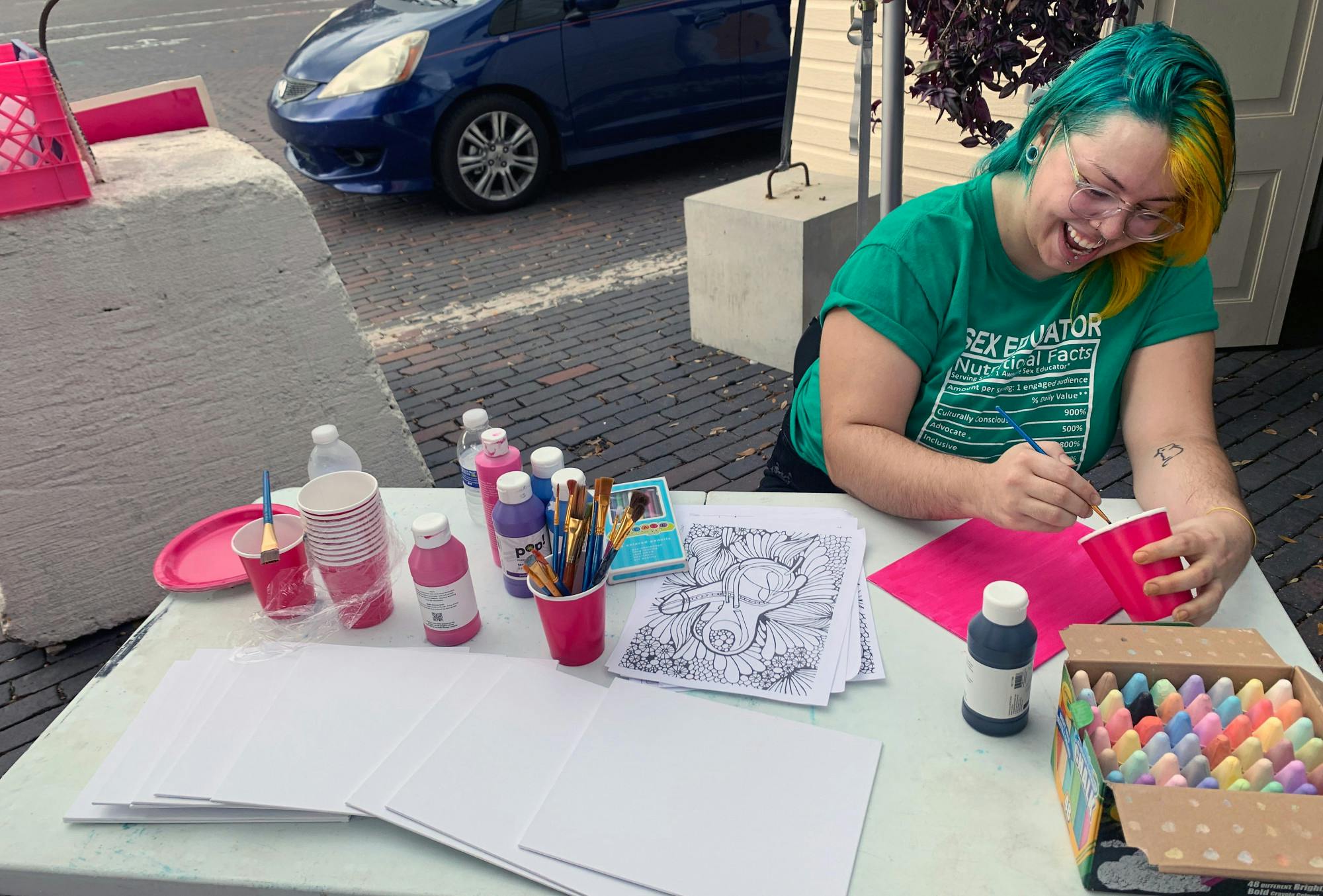 Kai Christmas, regional organizer of Planned Parenthood, paints at the Sex Positive Art Fest Sunday, Dec. 4, 2022.  