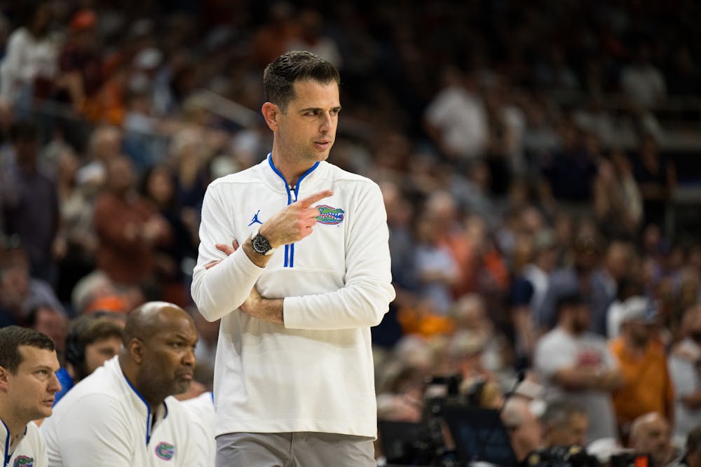 Florida Gators Head Coach Todd Golden points at one of his players during a basketball game against Auburn University on Feb. 8, 2025, in Auburn, Ala.