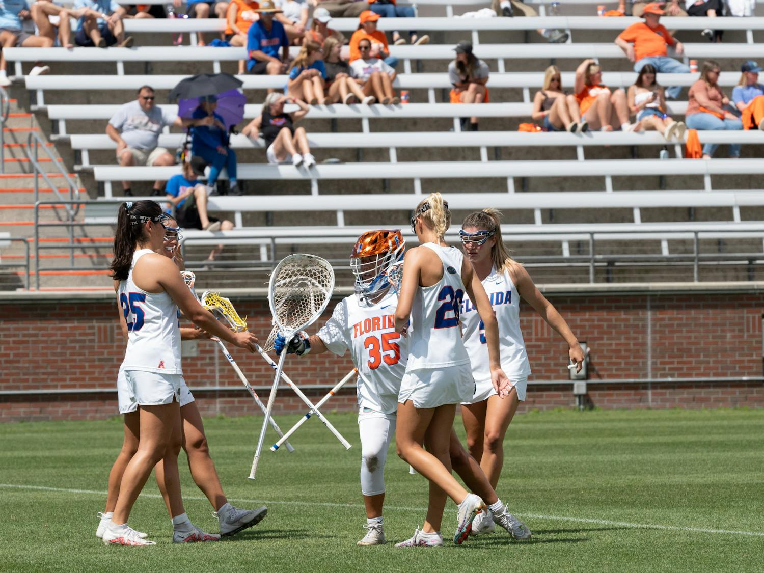 Florida lacrosse huddles up before playing a game against Old Dominion University on Saturday, March 23, 2024.