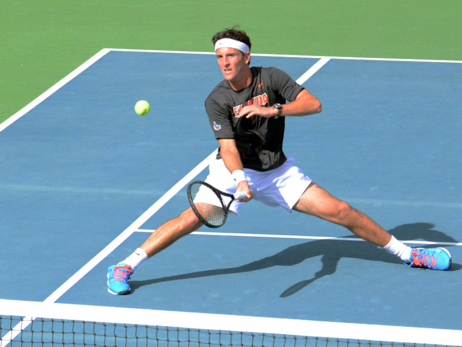 Gordon Watson hits an underhand volley during Florida men's tennis' 4-3 loss to Ole Miss on Jan. 31, 2015 at the Ring Tennis Complex.