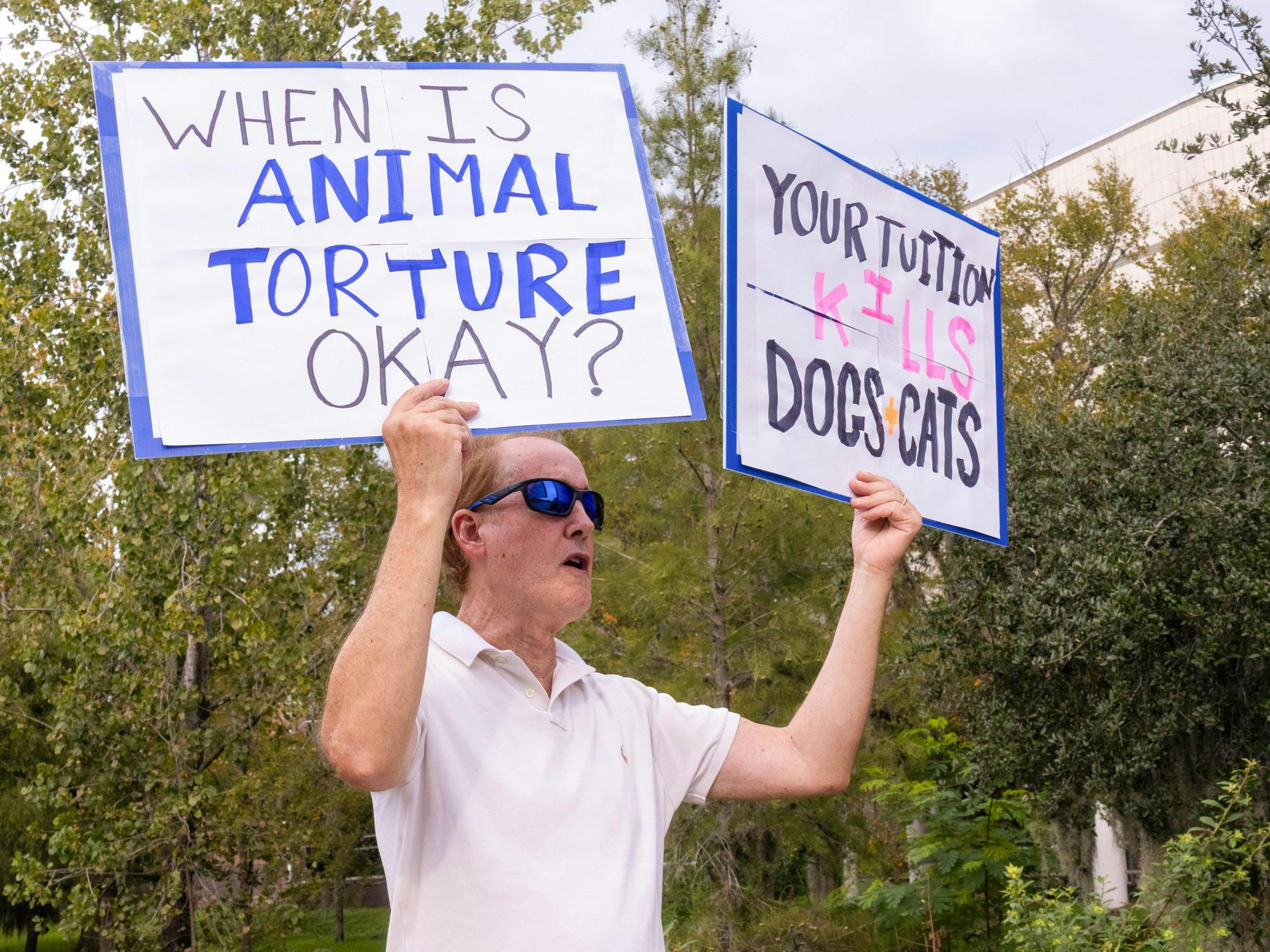 Local activists gather in front of UF’s Communicore Building to protest animal experimentation in UF labs, Friday, Oct. 16, 2026 in Gainesville, Fla.