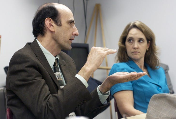 Commissioner Randy Wells and assistant director of Facilities, Planning and Construction at UF Linda Dixon discuss Innovation Square on Tuesday afternoon at a special economic development meeting at City Hall.