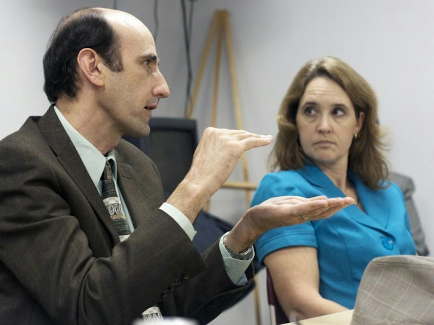 Commissioner Randy Wells and assistant director of Facilities, Planning and Construction at UF Linda Dixon discuss Innovation Square on Tuesday afternoon at a special economic development meeting at City Hall.
