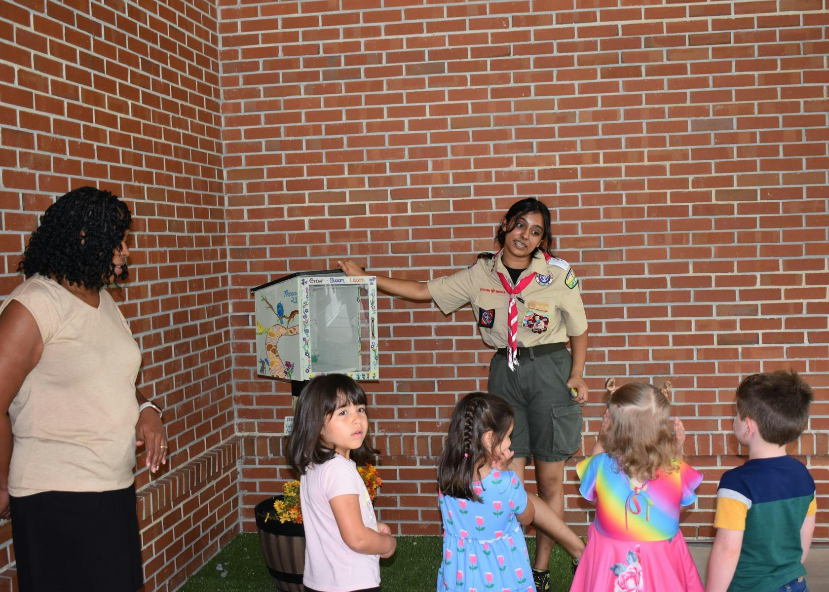 Eagle Scout, Kaayana Sharma, talks to Baby Gators about the new lending library, Thursday, July 30, 2026, at the UF Early Childhood Collaboratory at Diamond Village, in Gainesville, Fla.