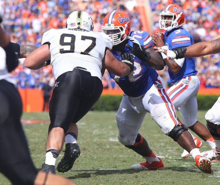 Jon Harrison (72) attempts to block Vanderbilt defensive tackle Jared Morse (97) as Tyler Murphy (3) drops back during the Gators’ 34-17 loss to the Commodores.