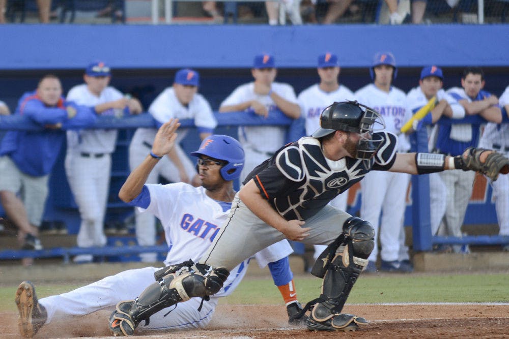 <p>UF's Buddy Reed slides home during Florida's NCAA Regional win against Florida A&amp;M on May 29, 2015.</p>