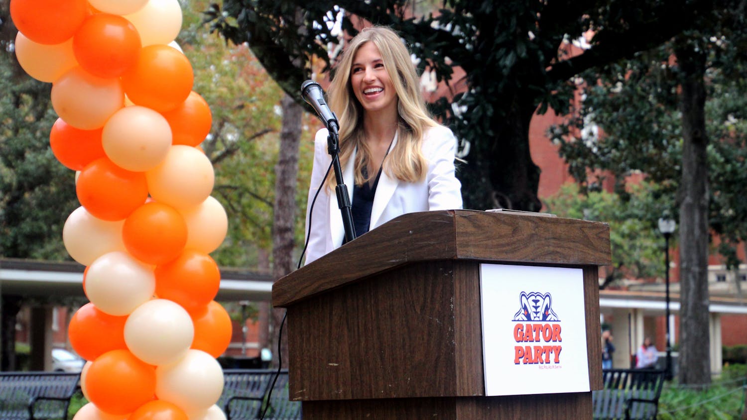Lauren Lemasters, Gator Party's nominee for Student Government president, walks up to the podium outside of Library West at the announcement of the party's executive ticket on Wednesday, Jan. 26.