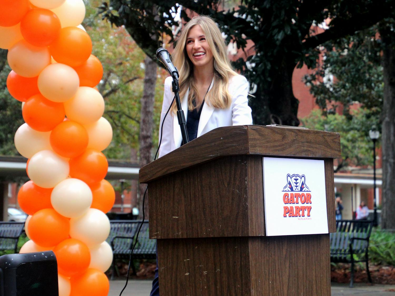 Lauren Lemasters, Gator Party's nominee for Student Government president, walks up to the podium outside of Library West at the announcement of the party's executive ticket on Wednesday, Jan. 26.