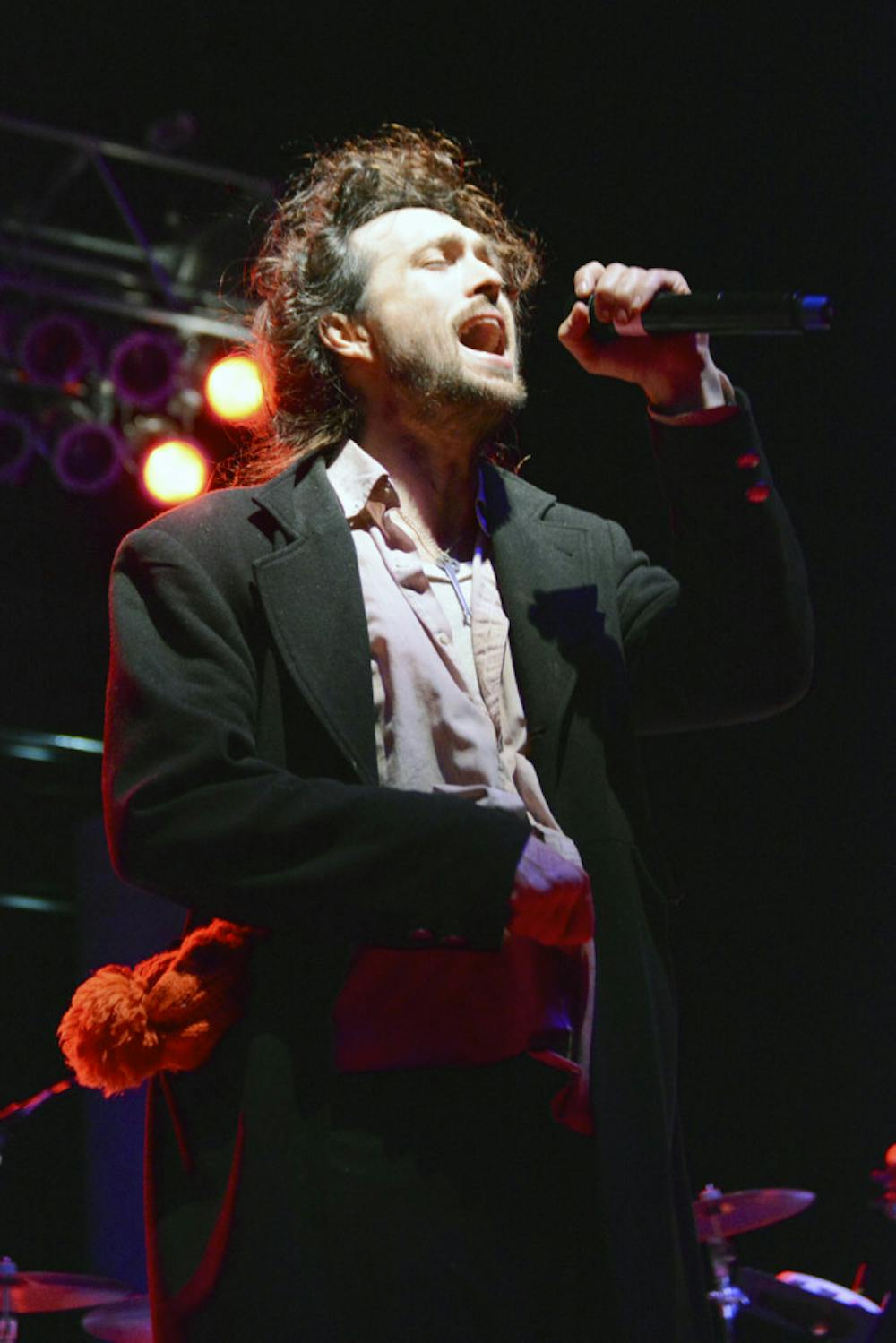 <p><span id="docs-internal-guid-60d494c0-b4e2-54cb-68f8-d085b102a95b"><span>Alex Ebert, the 36-year-old lead singer of indie folk band Edward Sharpe and the Magnetic Zeros, performs from atop the Flavet Field stage Friday night. Electronic music duo The Knocks opened the concert, which was attended by a large crowd of people despite the evening’s cold temperature.</span></span></p>