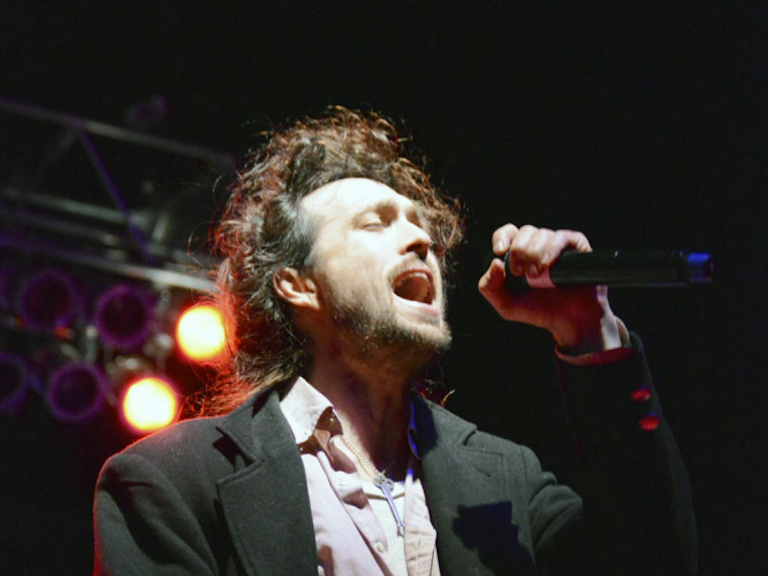 Alex Ebert, the 36-year-old lead singer of indie folk band Edward Sharpe and the Magnetic Zeros, performs from atop the Flavet Field stage Friday night. Electronic music duo The Knocks opened the concert, which was attended by a large crowd of people despite the evening’s cold temperature.