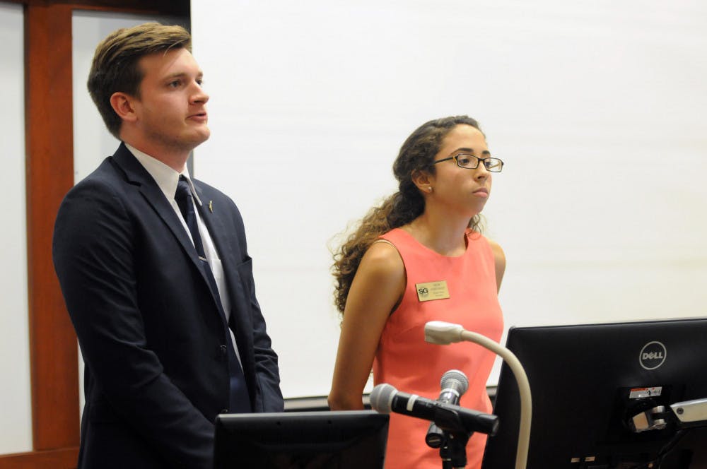 <p>Comprehensive Statute Reform Ad Hoc Committee Chairman Ty Robare (left) answers a question during the UF Student Senate meeting on Aug. 25, 2015, regarding the reforms to the 500 codes in the Student Body Statutes.</p>