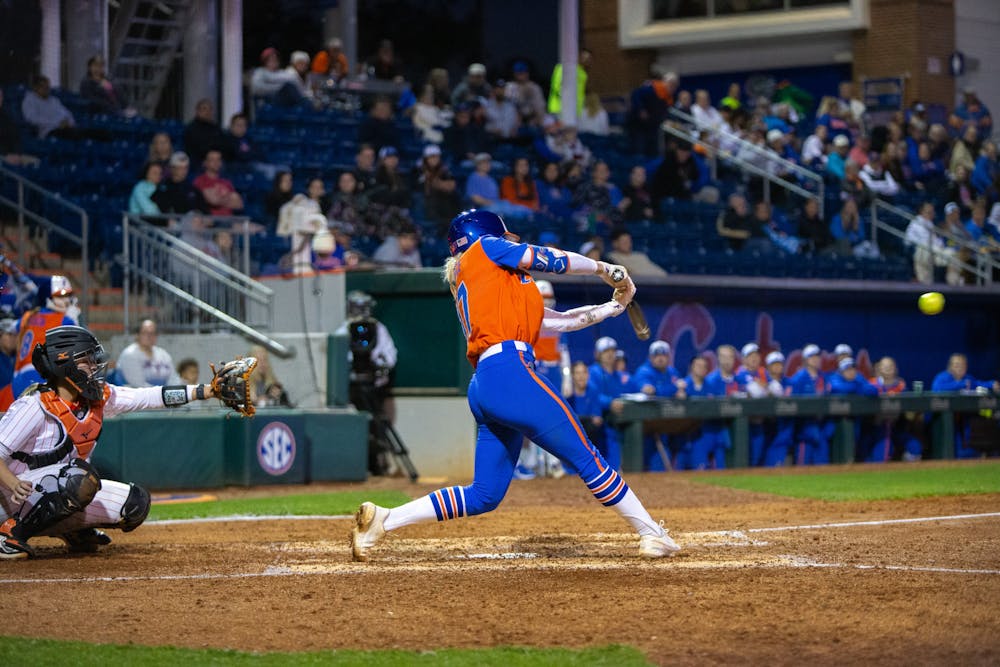 Gators softball redshirt senior Skylar Wallace comes through the ball in the team's loss to Oklahoma State on Monday, February 19, 2024. 