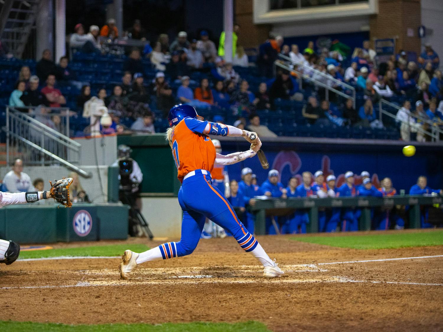 Gators softball redshirt senior Skylar Wallace comes through the ball in the team's loss to Oklahoma State on Monday, February 19, 2024.