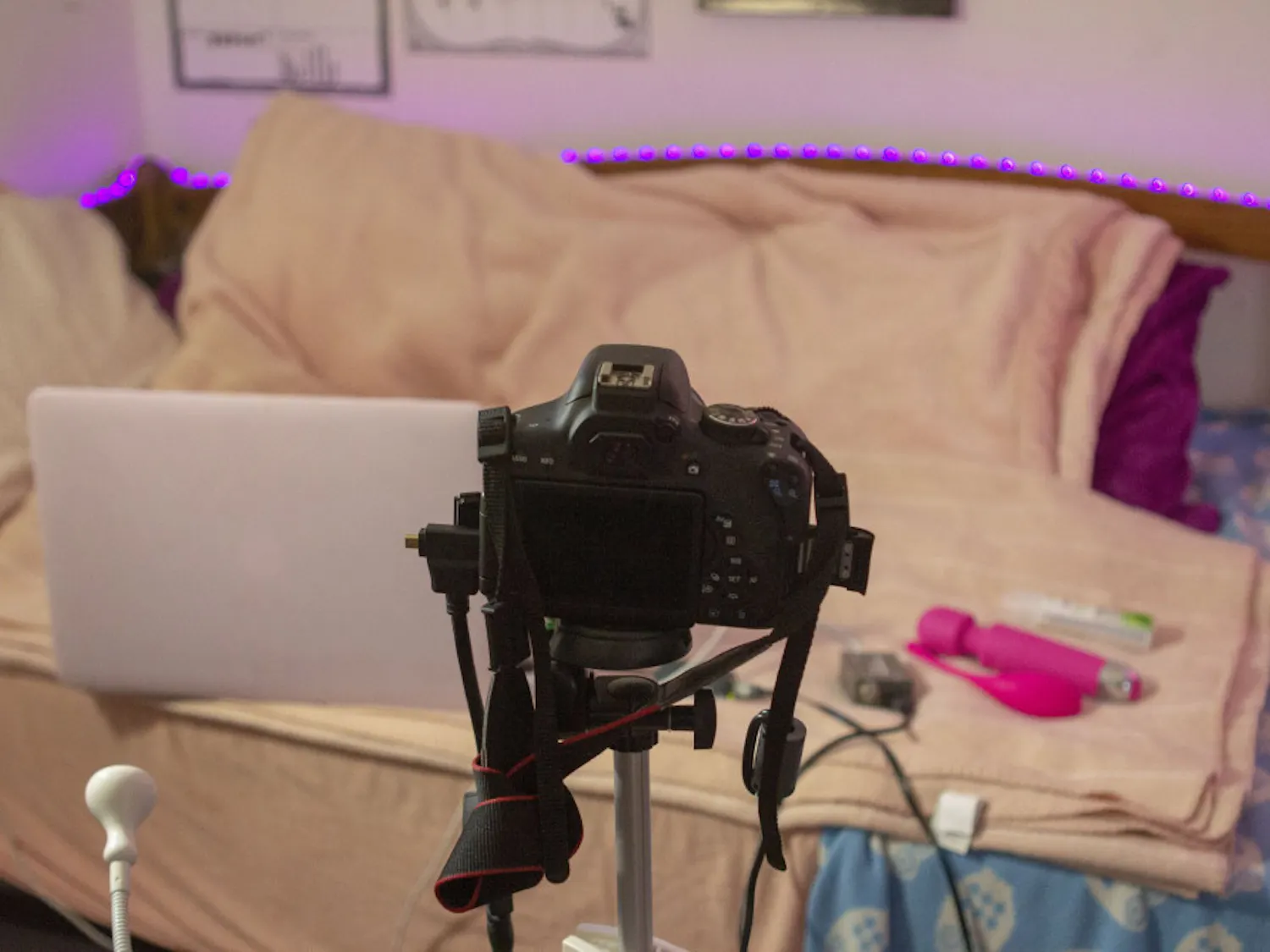 A.G. sets up her workplace before starting her sessions on camera.