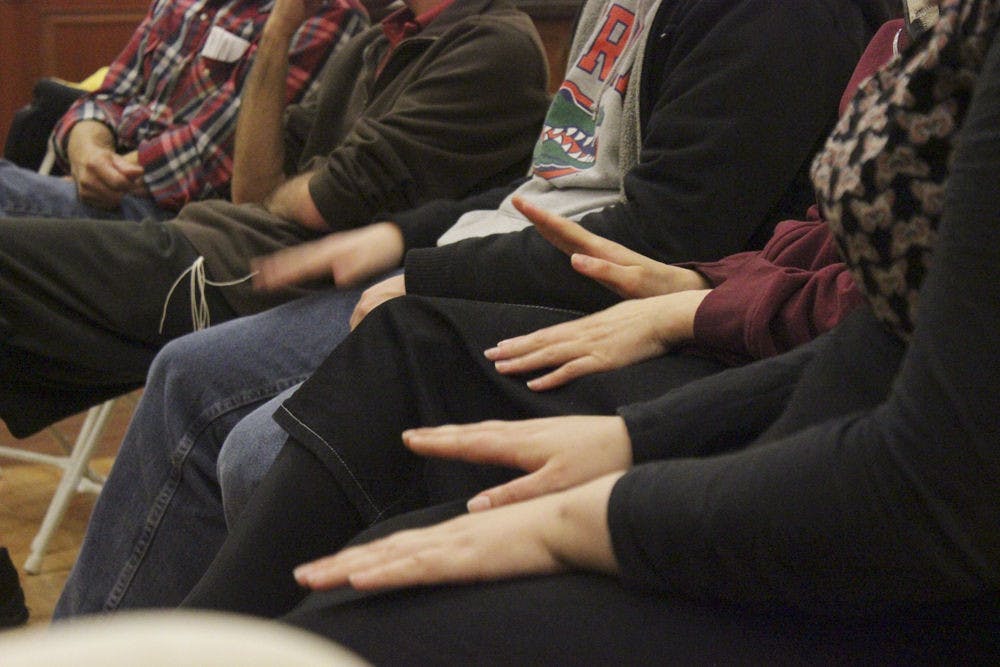 Attendees clap along to chants at Chabad's Tu B'Shvat celebration Monday. Tu B’Shvat, which began at sunset on Sunday and ended at nightfall Monday, is celebrated in Israel as an ecological awareness day.