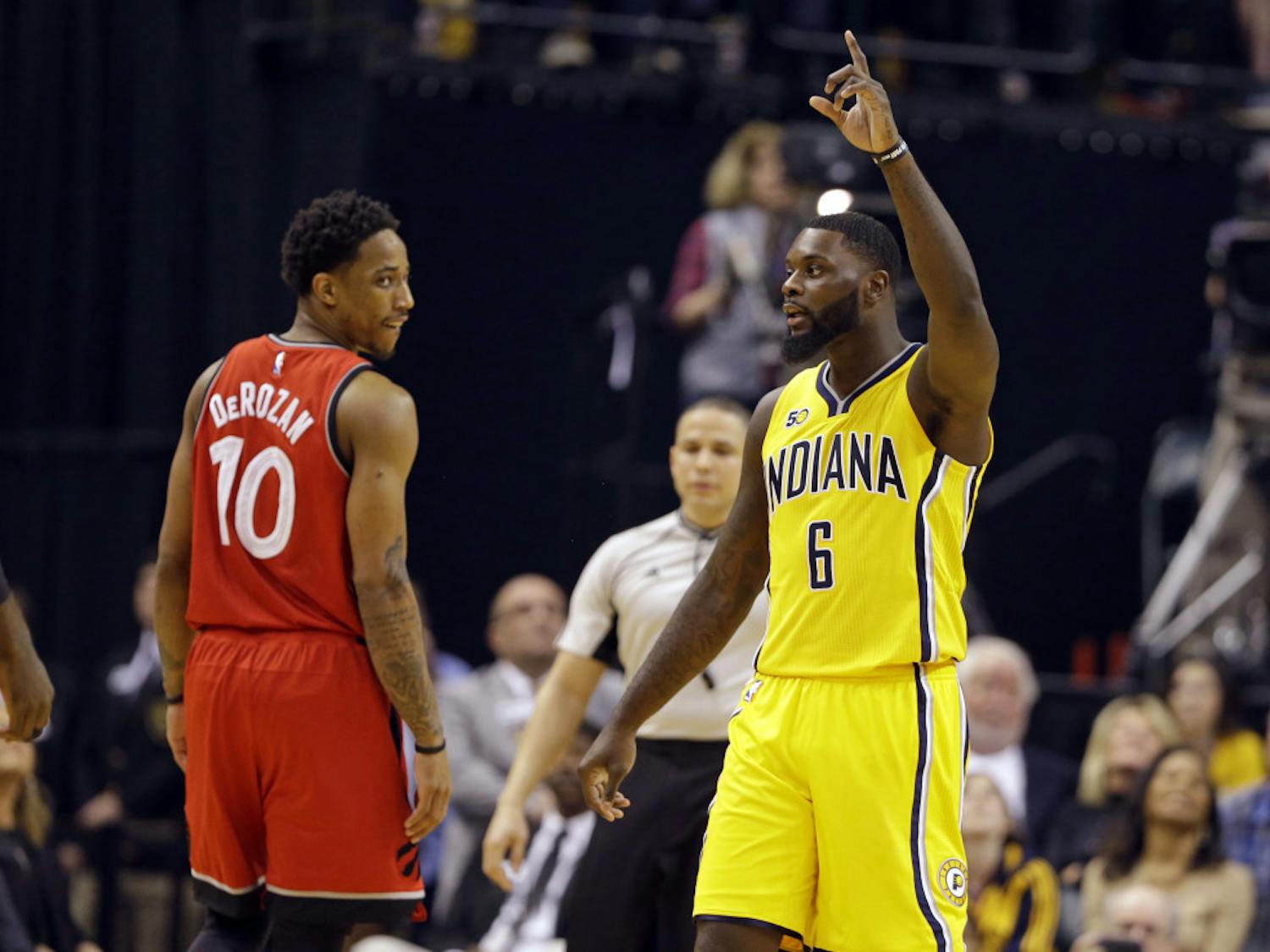 Indiana Pacers forward Paul George (13) celebrates as Toronto Raptors guard DeMar DeRozan (10) watches during the second half of an NBA basketball game in Indianapolis, Tuesday, April 4, 2017. The Pacers defeated the Raptors 108-90. (AP Photo/Michael Conroy)