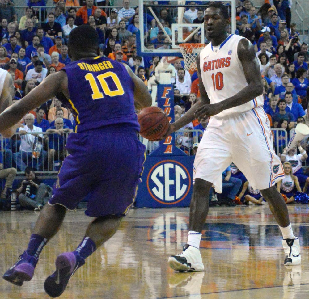 Dorian Finney-Smith scans the court during Florida's 79-61 win against LSU on Saturday in the O'Connell Center. Finney-Smith scored a team-high 16 points in the Gators' win over the Tigers.